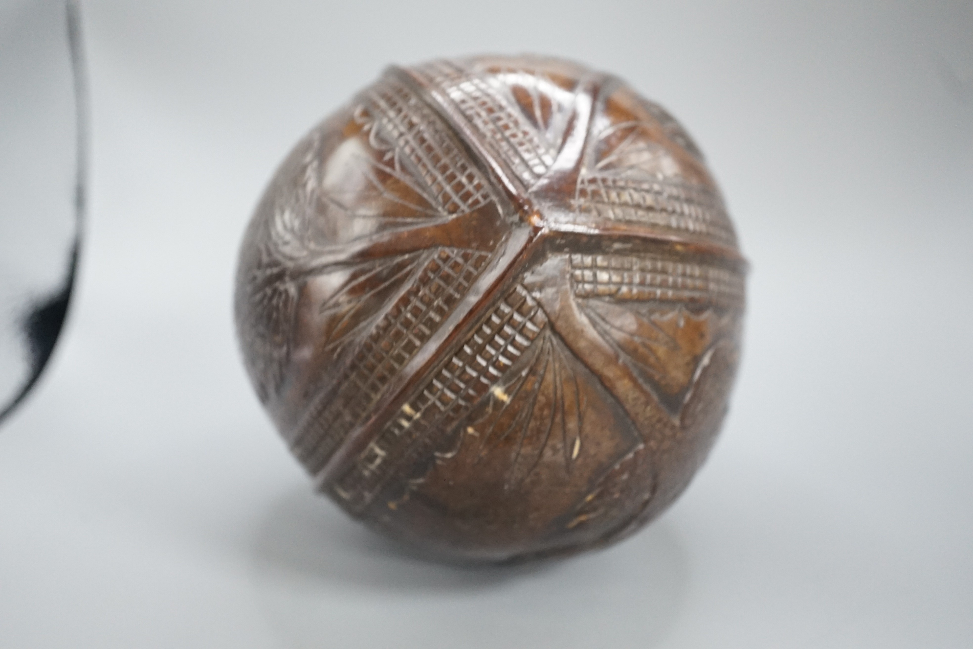 A 19th century carved coconut, 14 cm